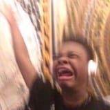 child of color reacting to music