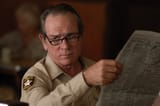 Tommy Lee Jones with Newspaper
