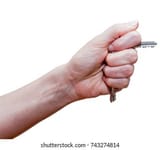 female-fist-clipped-keys-using-260nw-743274814