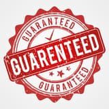 guaranteed-round-shaped-grunge-stamp-red-shade-ribbon-look_597133-2260