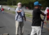 77557513-12725473-This_is_the_shocking_moment_one_of_two_environmental_protesters_-a-21_1699570133861