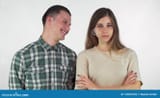 cheerful-handsome-man-laughing-his-annoyed-girlfriend-isolated-men-gorgeous-young-women-looking-angry-her-arms-crossed-133655352