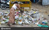 depositphotos_357677912-stock-photo-hindu-man-throwing-garbage-street