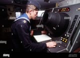 a-russian-sailor-monitors-a-navigational-radar-screen-on-board-the-russian-navy-ropucha-ii-class-tank-land...relief-exercise-subject-operationseries-cooperation-from-the-sea-base-vladivostok-state-siberia-country-russia-rus-2M8JHTA