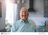 4836537-happy-senior-man-laughing-in-his-home-senior-adult-photocase-stock-photo-large