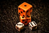 Artistic-orange-and-white-dice-with-sitting-poses-for-photos