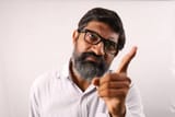 white-background-conceptual-studio-shoot-of-a-angry-indian-bearded-man