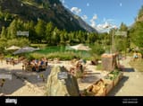 tasch-switzerland-18-july-2020-people-drinking-in-a-beach-bar-of-the-lake-at-tasch-on-the-swiss-alps-2CXPKDK