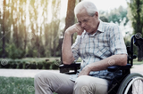 old_sad_man_in_wheelchair