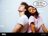 lifestyle-and-people-concept-young-multinational-couple-together-students-indian-and-caucasian-happy-boy-hugging-girl-P8B6WY