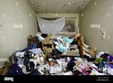 a-hoarder-situation-inside-a-bedrooom-of-an-abandoned-home-with-mold-covered-walls-ontario-canada-2EWE0B7[1]