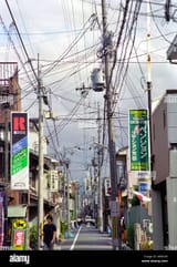 dense-power-lines-cover-a-street-in-tokyo-japan-A06N36