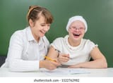 happy-teacher-helps-learning-girl-260nw-1522762982