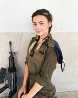 IDF soldier kneeling in braids