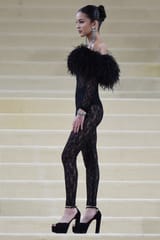 Olivia-Rodrigo-Saint-Laurent-black-see-through-lace-bodysuit-with-feather-trims