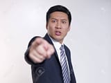 18987609-angry-asian-businessman-pointing-at-camera-focus-on-face