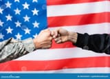 cropped-soldier-fist-bumping-civilian-man-near-american-flag-blurred-background-view-202256560