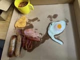 2_People-baffled-by-disgusting-Alton-Towers-breakfast-with-mug-full-of-beans
