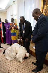pope kissing niggers feet