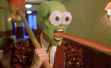 green face white eyes pink tongue