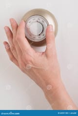 home-thermostat-room-wall-temperature-turn-dial-to-set-64591180