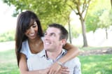 stock_-an-attractive-man-and-woman-couple-in-the-park-in-love