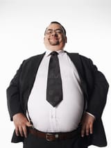 smiling-overweight-businessman-hands-hips-portrait-standing-against-white-background-31840300