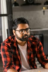 head-shot-portrait-smart-confident-smiling-millennial-indian-man-handsome-hindu-student-guy-freelancer-at-home-photo