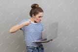 woman-having-bad-mood-are-ready-punch-worker-through-webcam-with-raised-fist-with-angry-face_416530-32713-2718526398