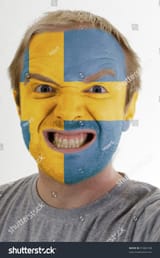 stock-photo-high-key-portrait-of-an-angry-man-whose-face-is-painted-in-colors-of-swedish-flag-91865108