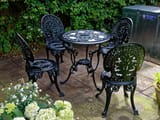 Cast_iron_outdoor_table_and_chairs_at_Boreham,_Essex,_England