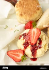british-cream-tea-scones-with-clotted-cream-strawberry-jam-and-strawberries-on-white-background-food-still-life-2BM1H87