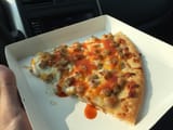 breakfast pizza with hot sauce