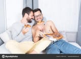 depositphotos_405841540-stock-photo-gay-couple-eating-pizza-bed