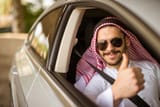 58283213-handsome-muslim-man-showing-thumbs-up-in-the-car