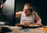 angry-furious-man-sitting-computer-home-close-up-side-view-photo-isolated-black-background-irritation-concept-194453850