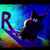 Chowder escaping through a dark alley from the big R face