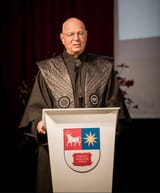 schwab in his weird ass robes