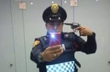 PAY-Cop-takes-selfie-pointing-gun-at-his-own-head