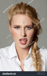 stock-photo--sexy-blond-woman-licking-her-lips-115228840