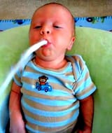 baby sucking a spaghetti