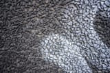 white-graffiti-tag-stone-gravel-wall-272018510
