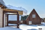 large-snowdrift-roof-rural-house-snow-accumulated-over-winter-slides-off-wooden-thaw-267085446