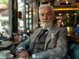 older-man-suit-sitting-table_1025556-25141-311510488
