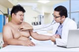 doctor-checking-fat-man-shoot-hospital-41582280
