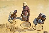 Mine-workers-knee-deep-digging-