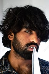 151517036-a-brutal-indian-dacoit-staring-at-camera-with-a-knife-in-his-hand-he-has-an-unkempt-look-he-is-20