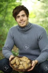 26261137-man-holding-a-basket-of-potatoes