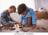 boys-playing-children-pajamas-toys-260nw-2435888955