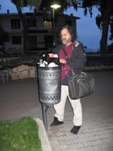 homeless man computing in trash can